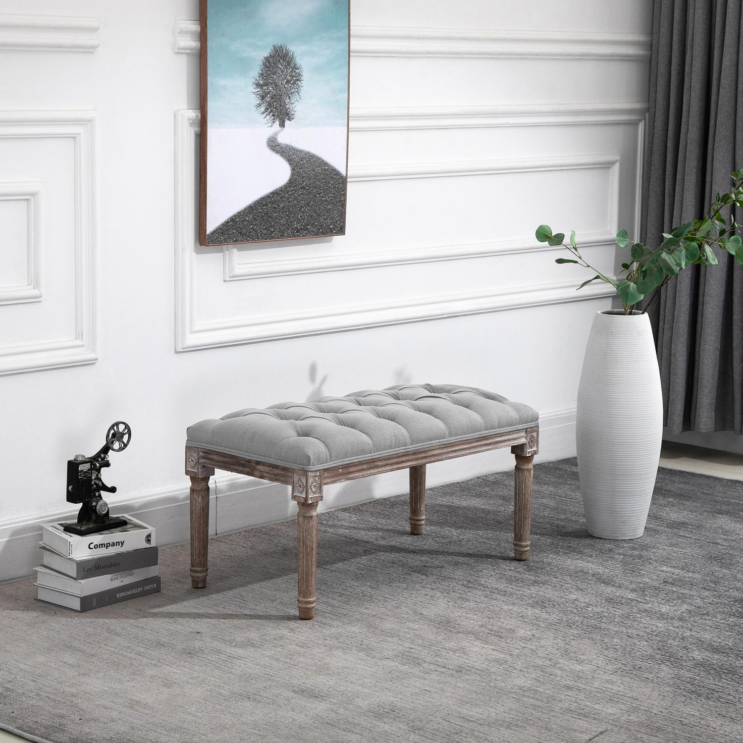 Grå stoppad bänk - vintagestil med knappdetalj